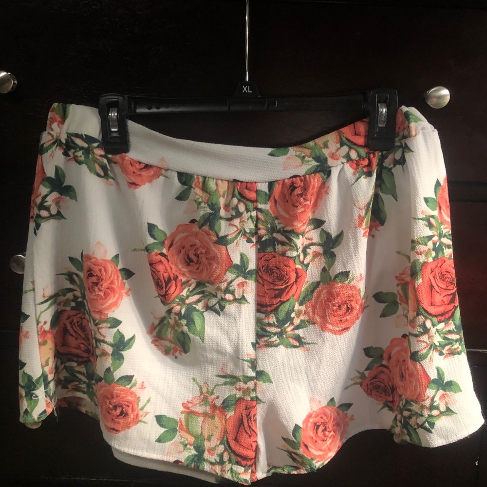 Fashion nova white shorts with roses.